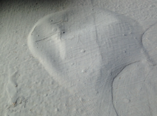 Example of pinholing caused by inadequate substrate surface preparation and or membrane application