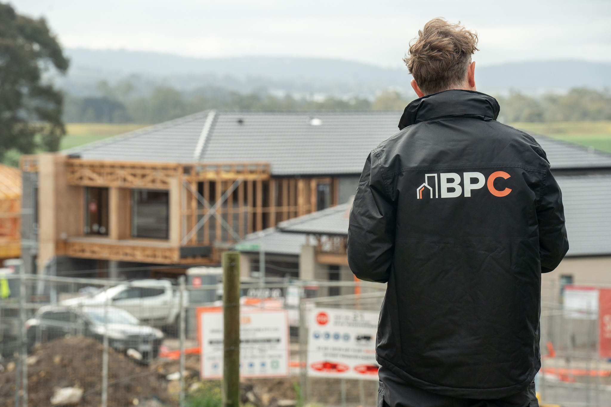 a BPC employee stands over a contrustion site