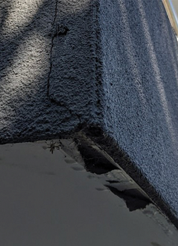 Cracks in the facade finish and peeled paint may be indicative of the presence of moisture.