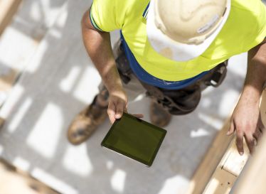 Practitioner using an Ipad on site
